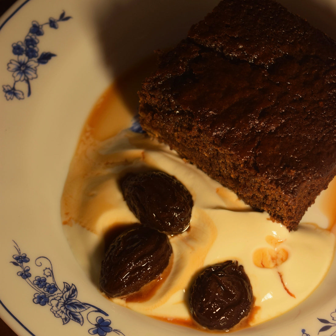 Ginger treacle cake with boozy prunes